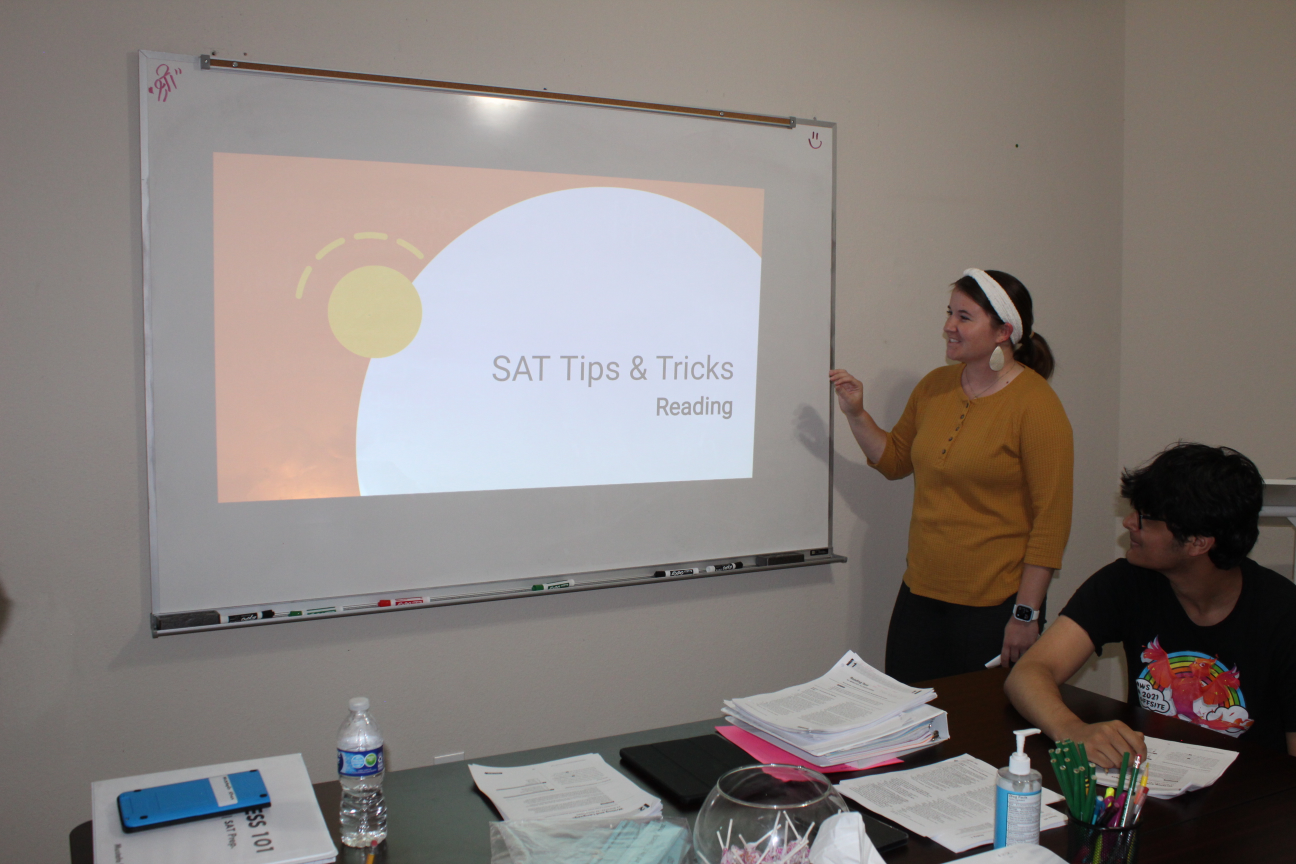 Tutor helping students during a lesson